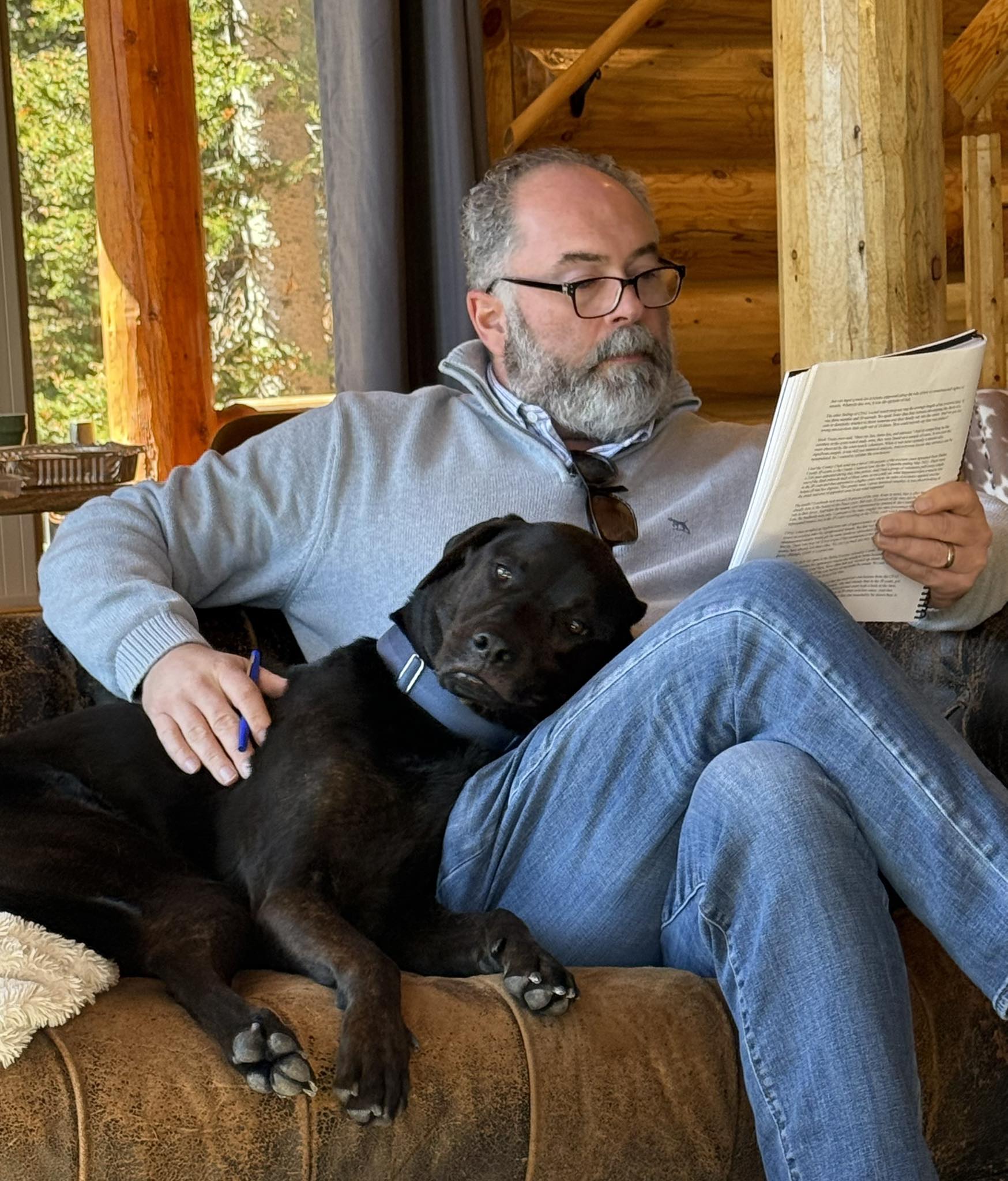 Mark Melton, attorney and founder of the Dallas Eviction Advocacy Center, reading the manuscript of Injustice of the Peace
